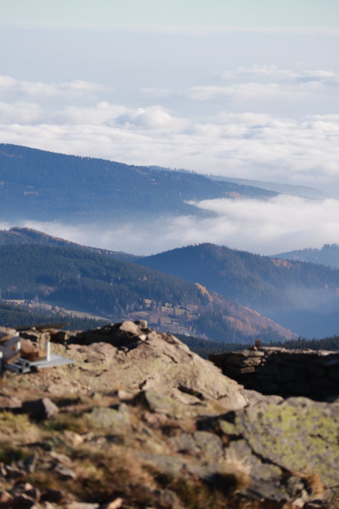 Breathtaking landscape of Karpacz mountains with clouds and forests in Poland.
